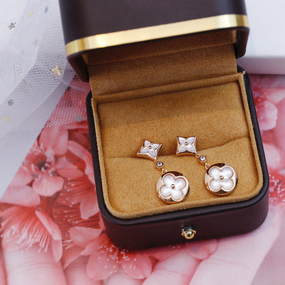 [Luxora]Ohrringe mit Stern- und Sonnenmotiv in Rosagold